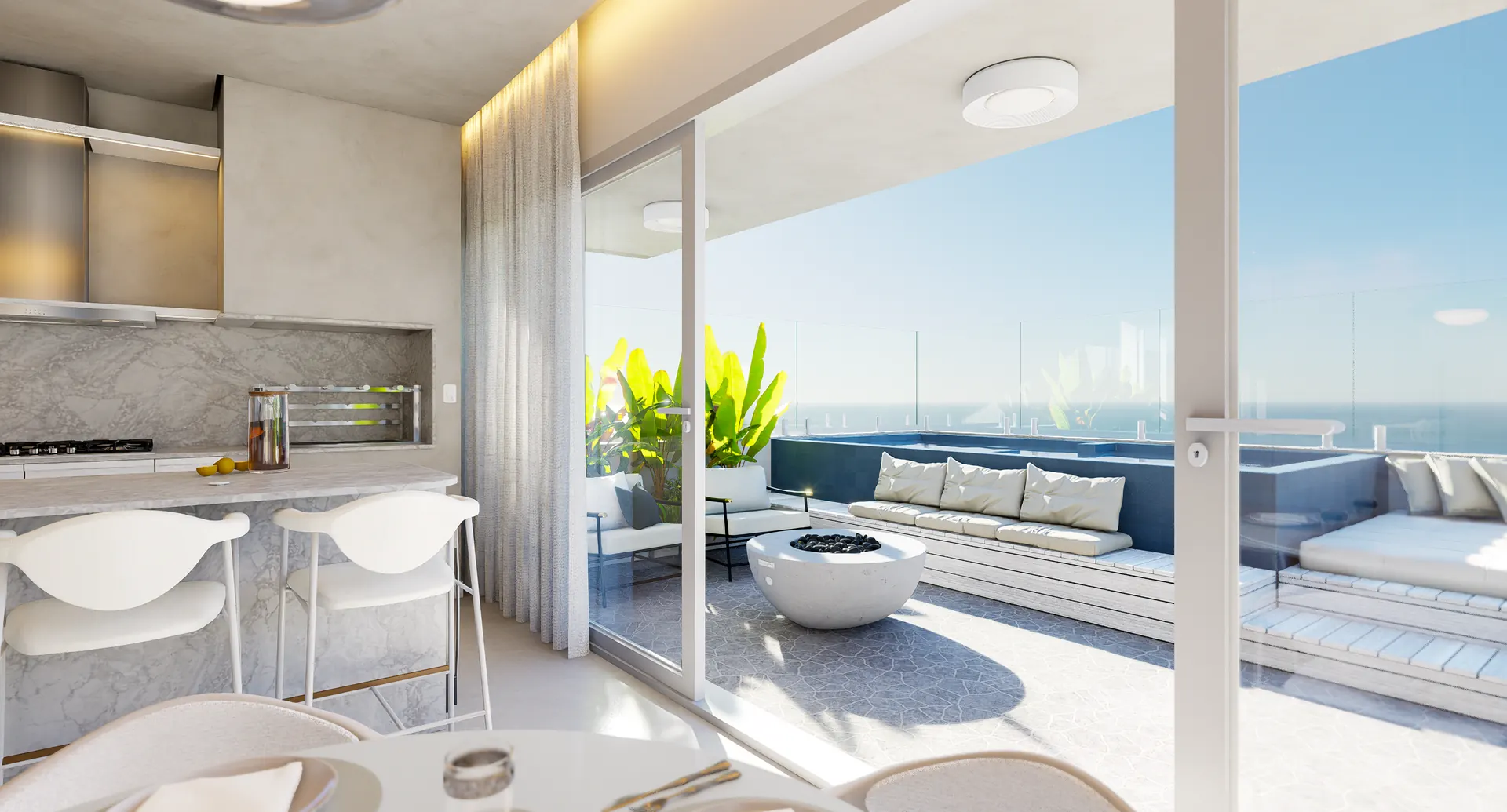 Living integrado à varanda de uma cobertura, com mesa posta, lareira ecológica e vista para o mar